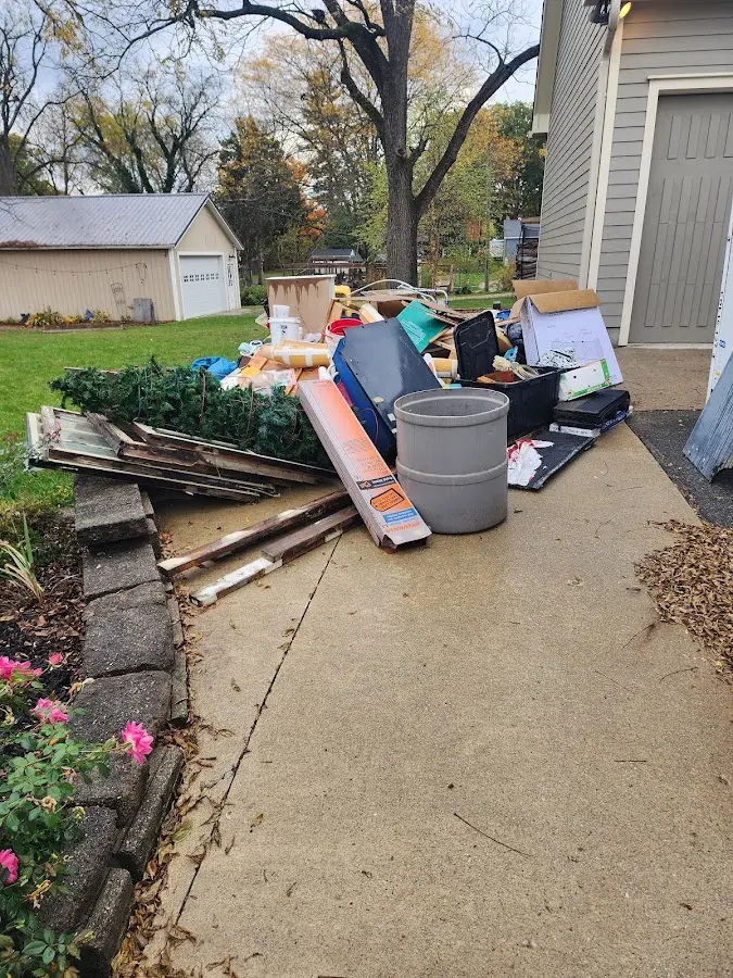 Dumpster being loaded with debris for Commercial Dumpster Rental in Crescent City